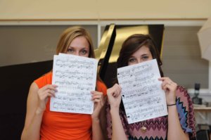Jennifer and Abigail holding sheet music