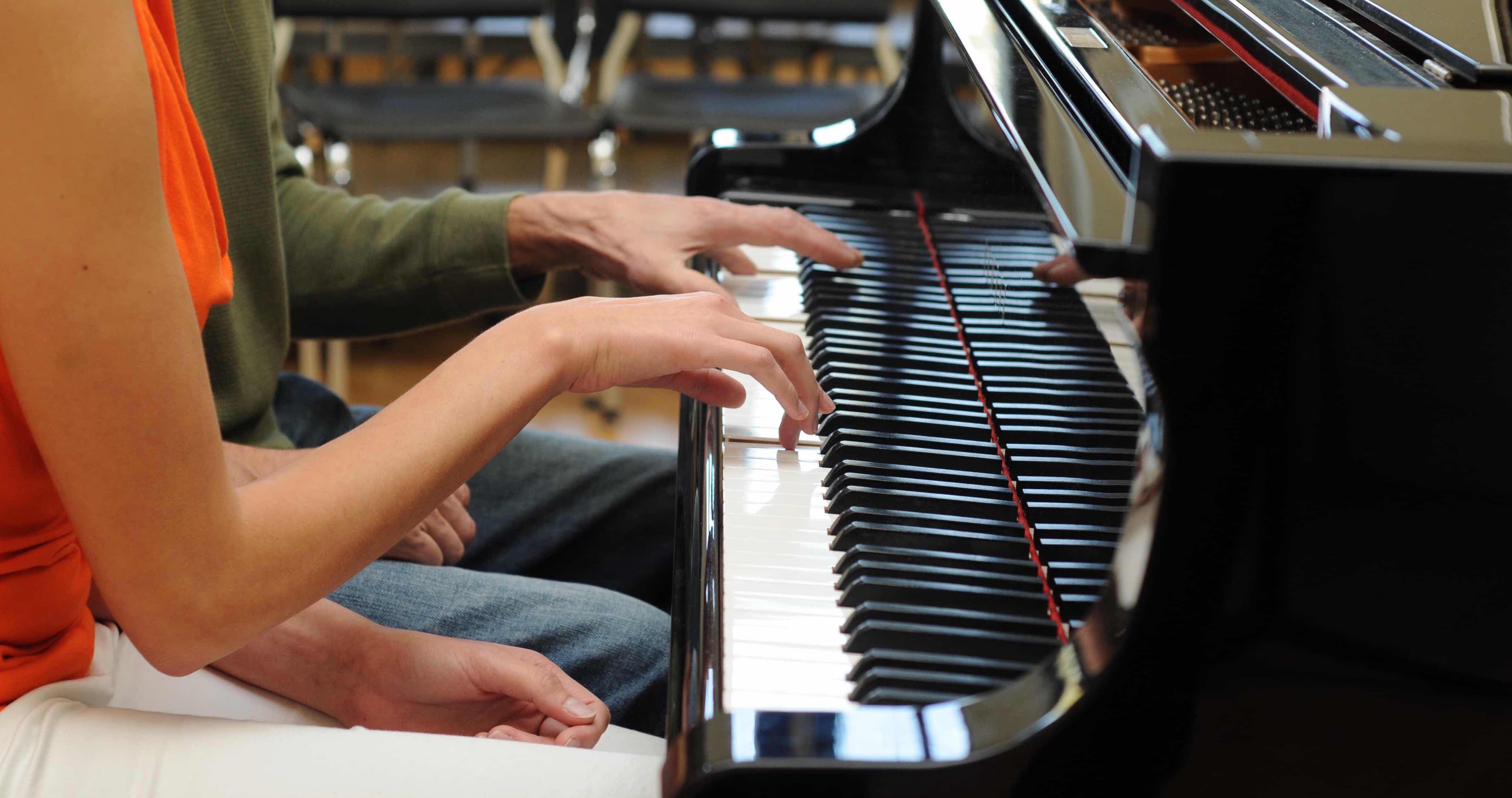 Playing a duet on the piano